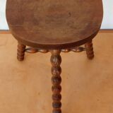 Beaded leg tripod stool