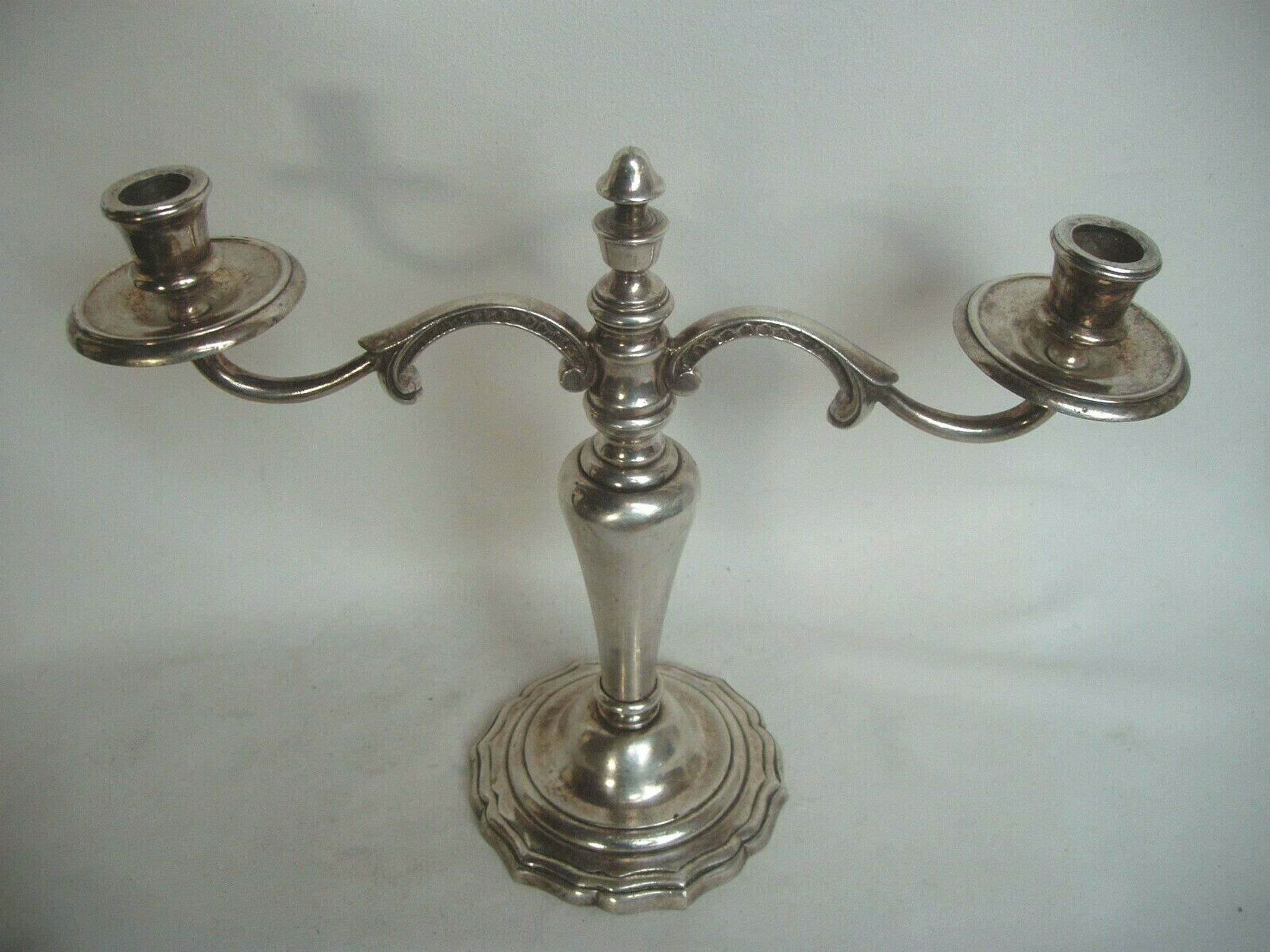 Two-branch silver-plated candle holder from the early twentieth century.