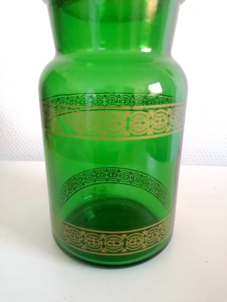Apothecary jar in vintage green and gold glass