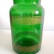 Apothecary jar in vintage green and gold glass