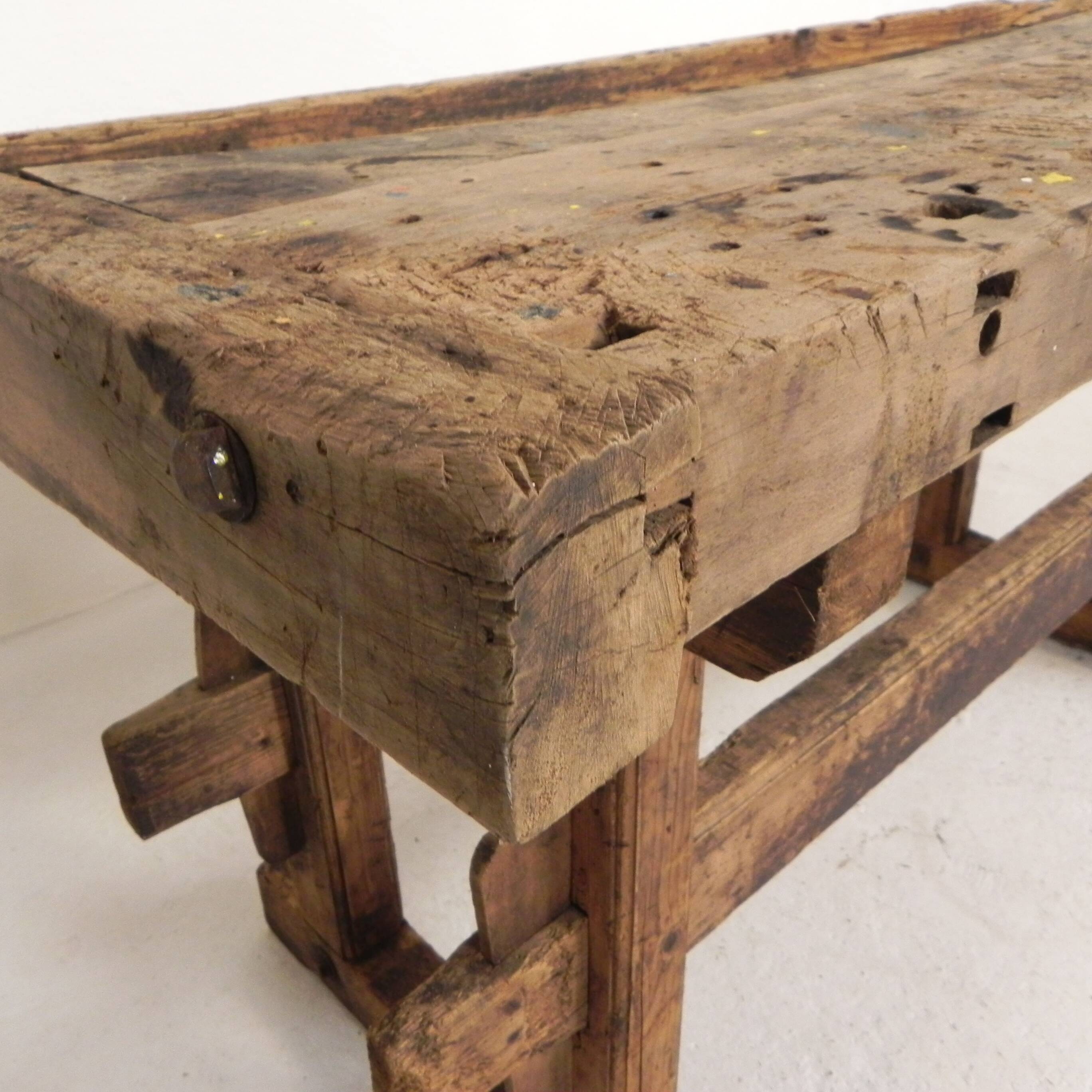 Wooden industrial workbench with vice, 194 cm long, 1930s.