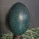 Emu egg naturally green / blue on dark wood bases