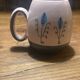 Set of two ceramic mugs signed Yvon ROY.