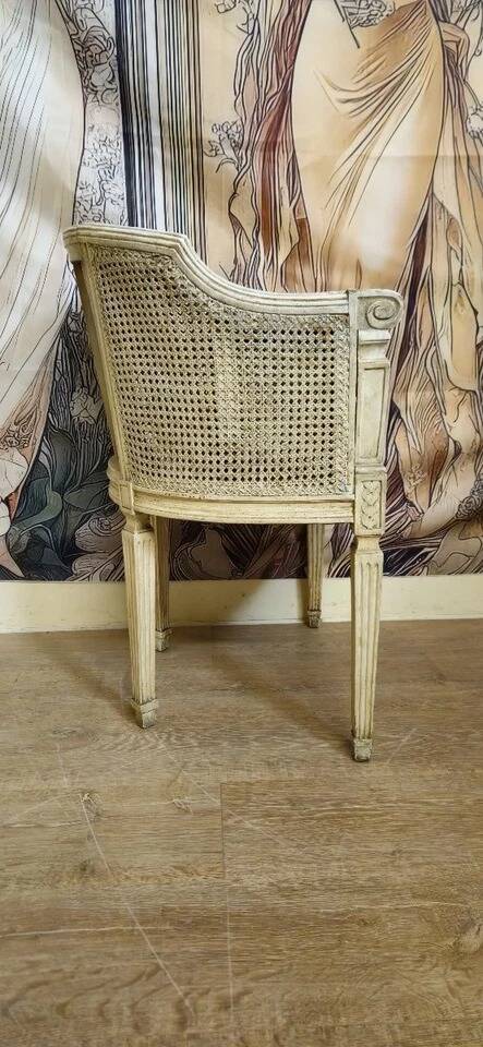 Gondola armchair in Louis XVI style, carved wood with a cream patina.