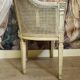 Gondola armchair in Louis XVI style, carved wood with a cream patina.