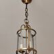 Cylindrical brass and glass lantern in Louis XVI style.