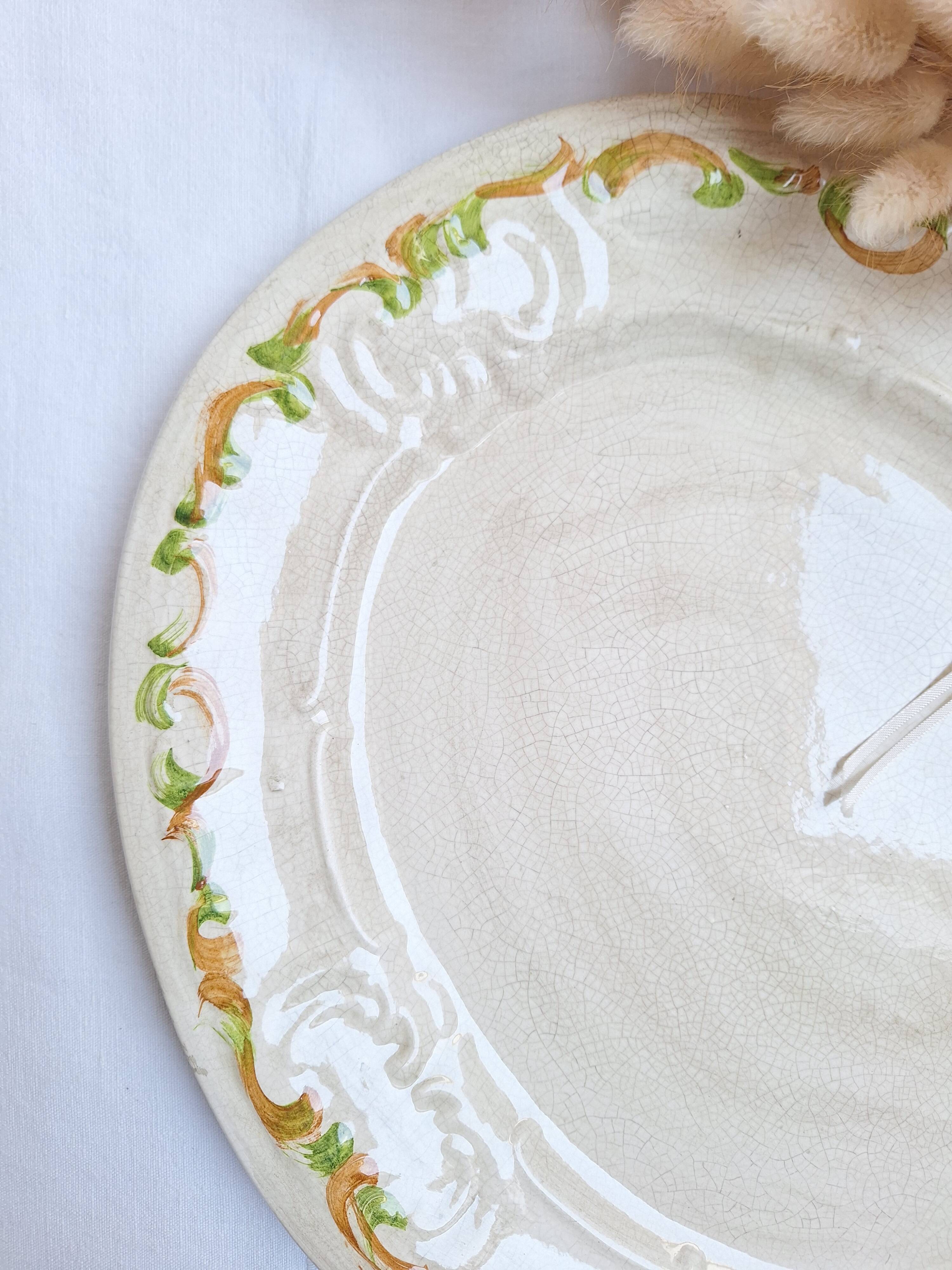 Oval plate, hand-painted meat platter in orange and green.