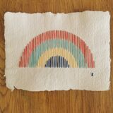 Rainbow embroidery on recycled paper