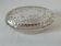 Vintage glass butter dish with cow decoration.