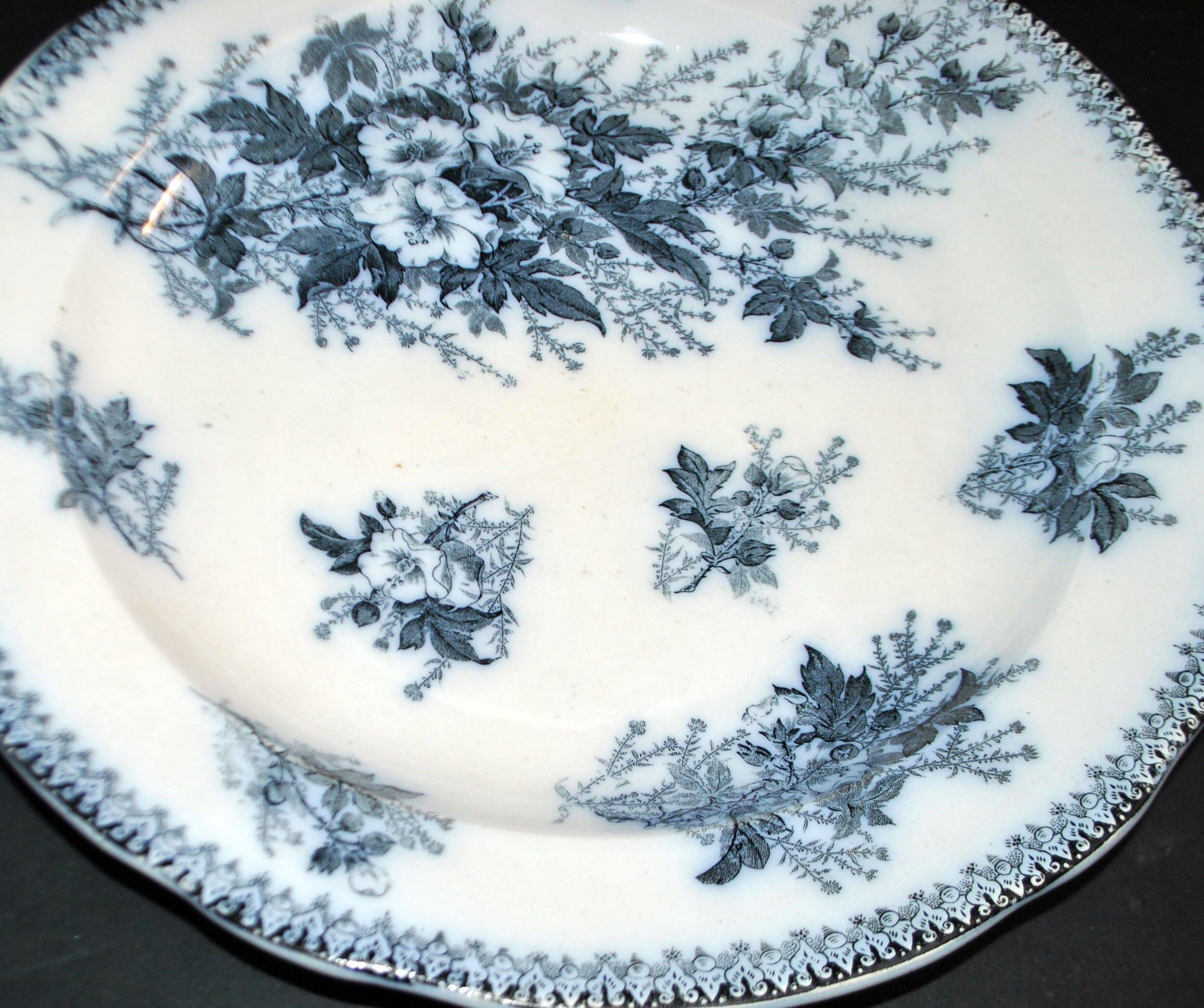 Large round antique plate with monochrome blue and black floral decoration, circa 1850.