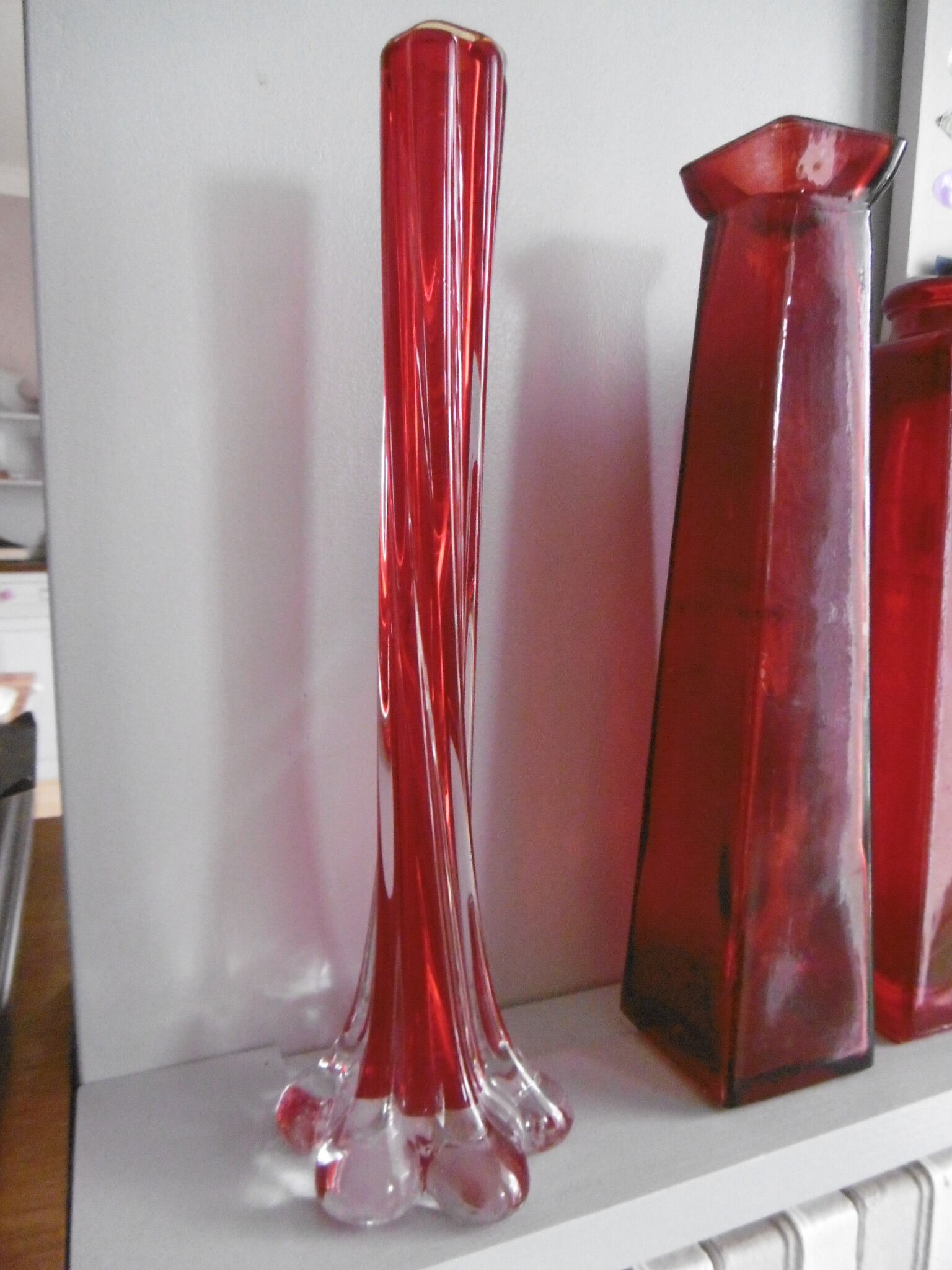 Set of three red bottles