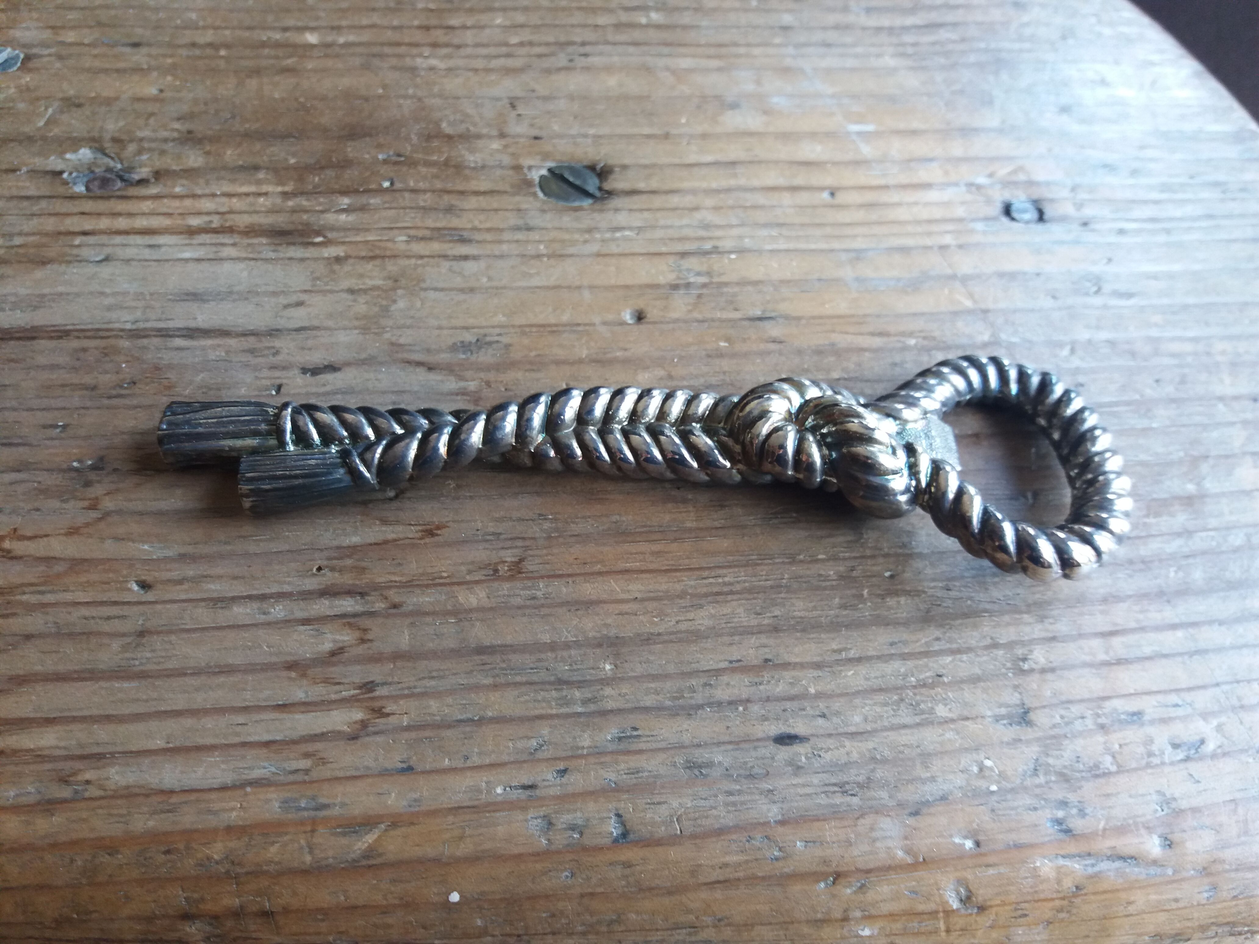 Silver metal rope bottle opener