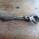 Silver metal rope bottle opener