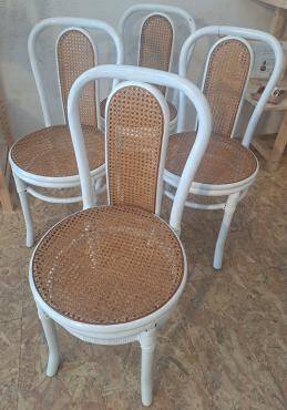 4 white rattan and cane chairs