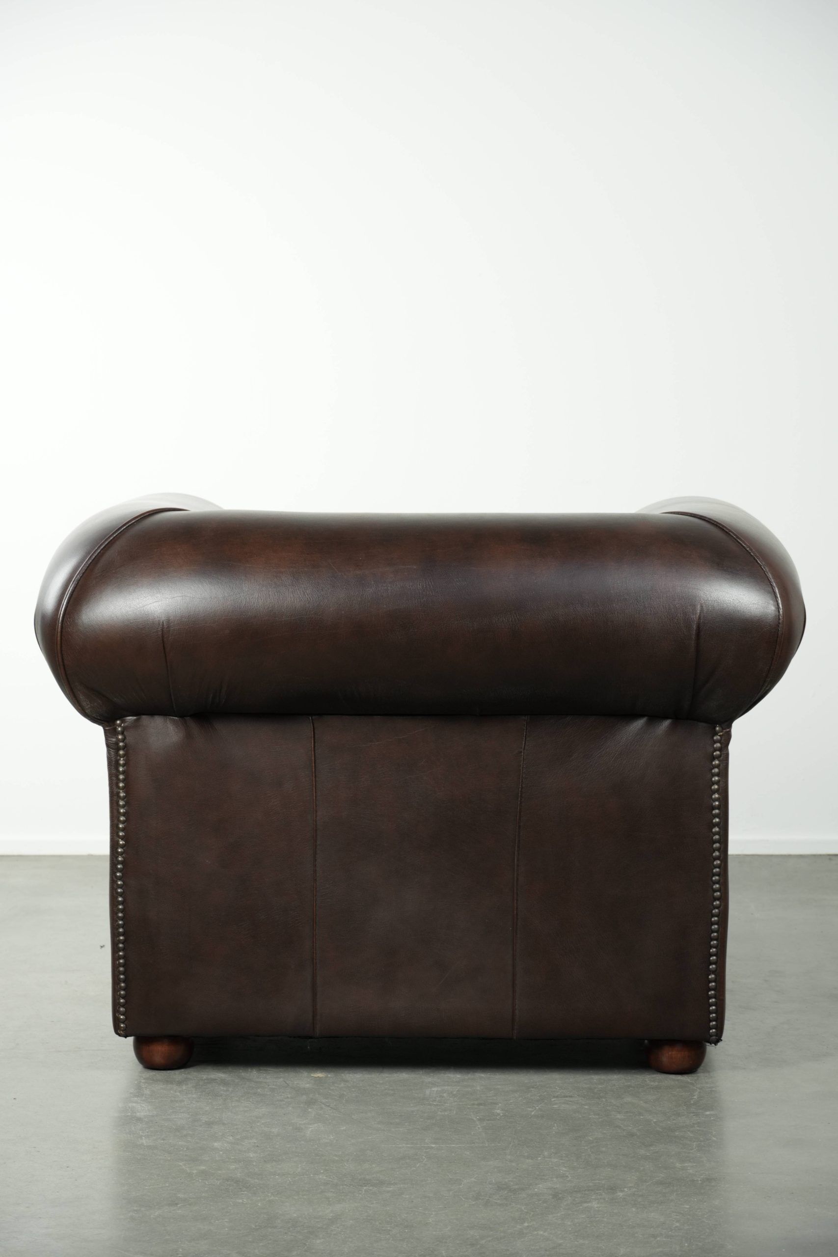 Luxury brown cow leather Chesterfield armchair with a timeless English look