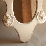 Miroir vintage en bois sculpté.