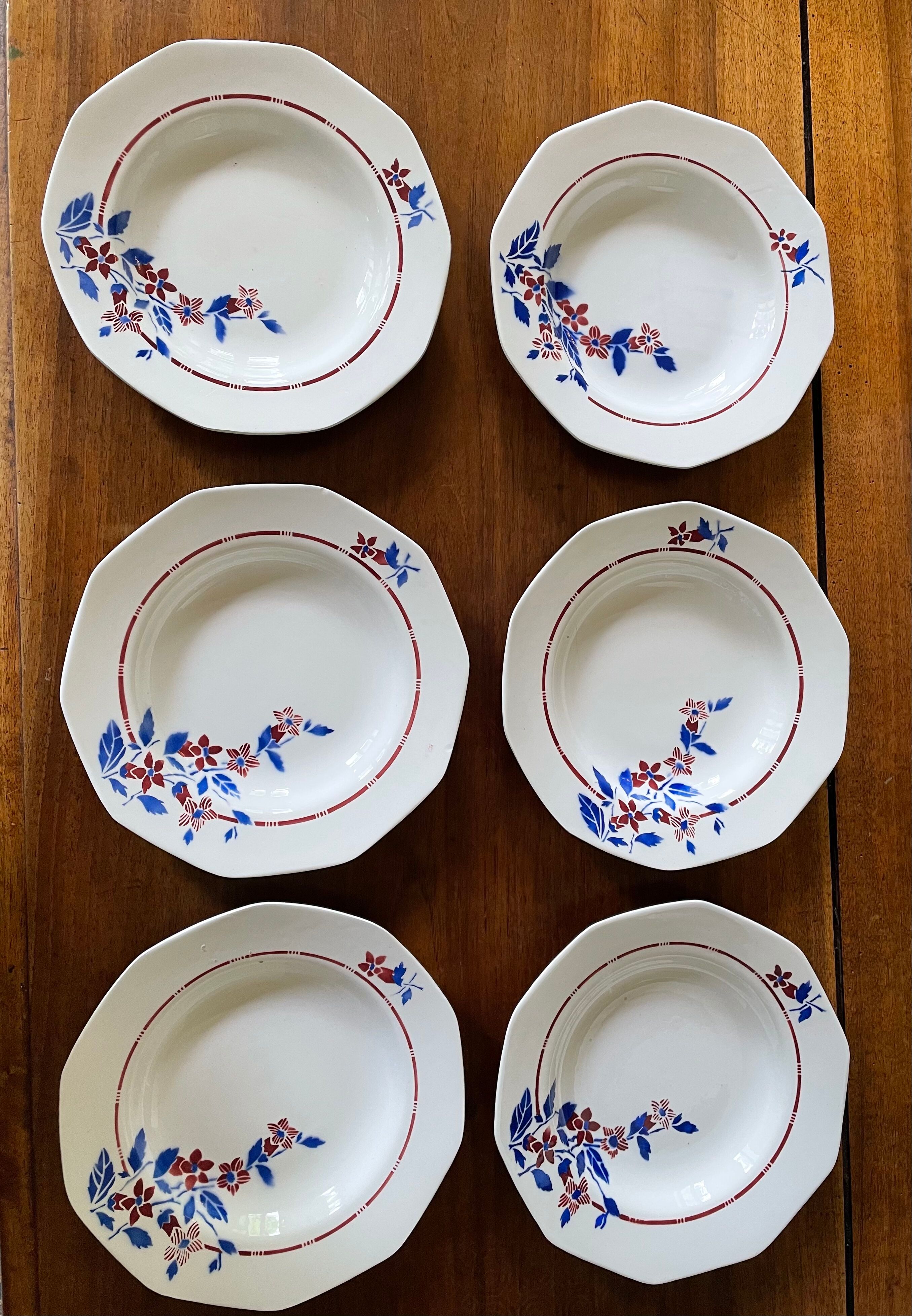 Saint Amand hollow plates decorated with red and blue flowers