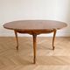 Round Louis XV dining table in solid cherry wood.