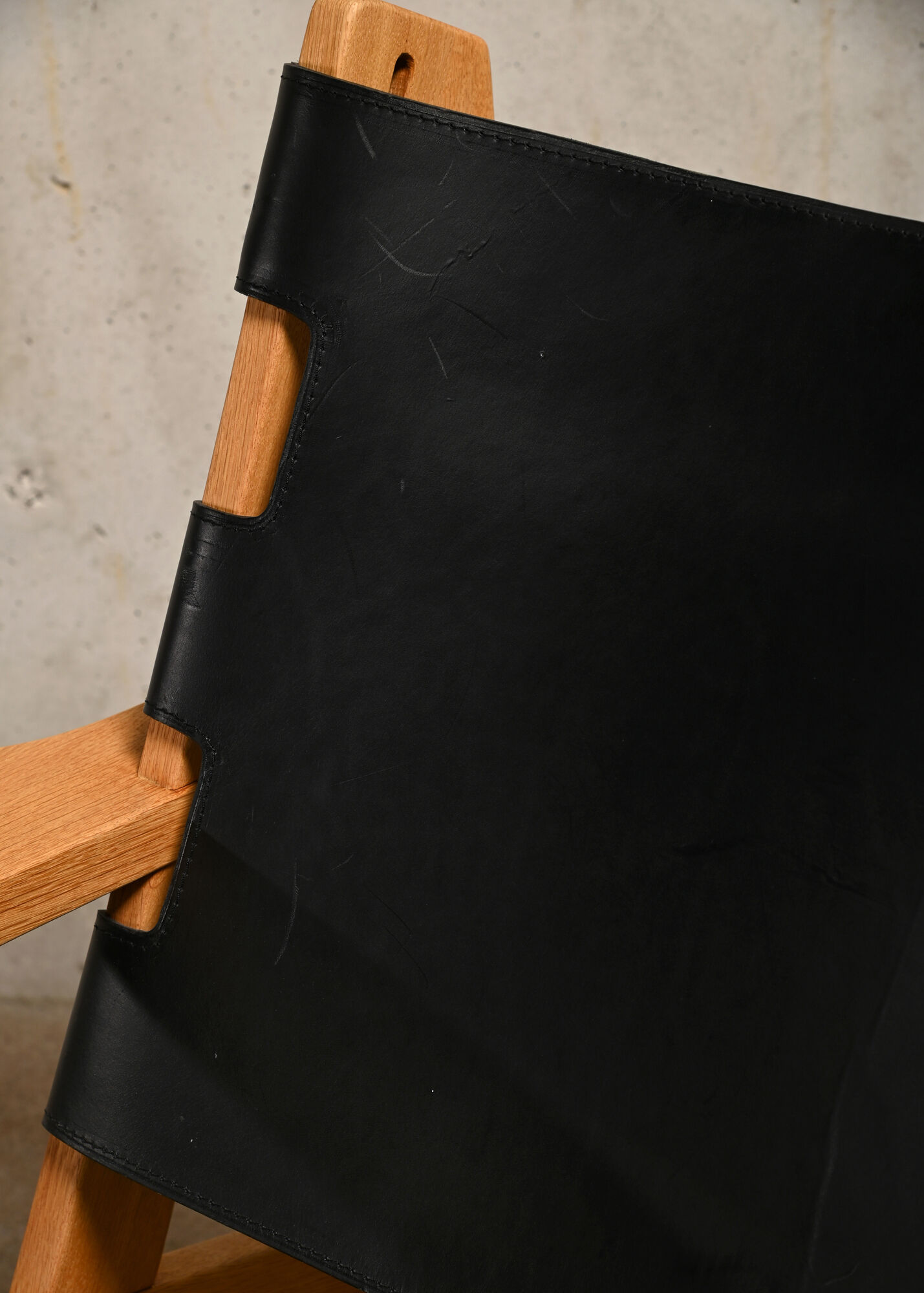 Kurt Østervig hunting chair in black leather for K. P. Jørgensens Møbelfabrik