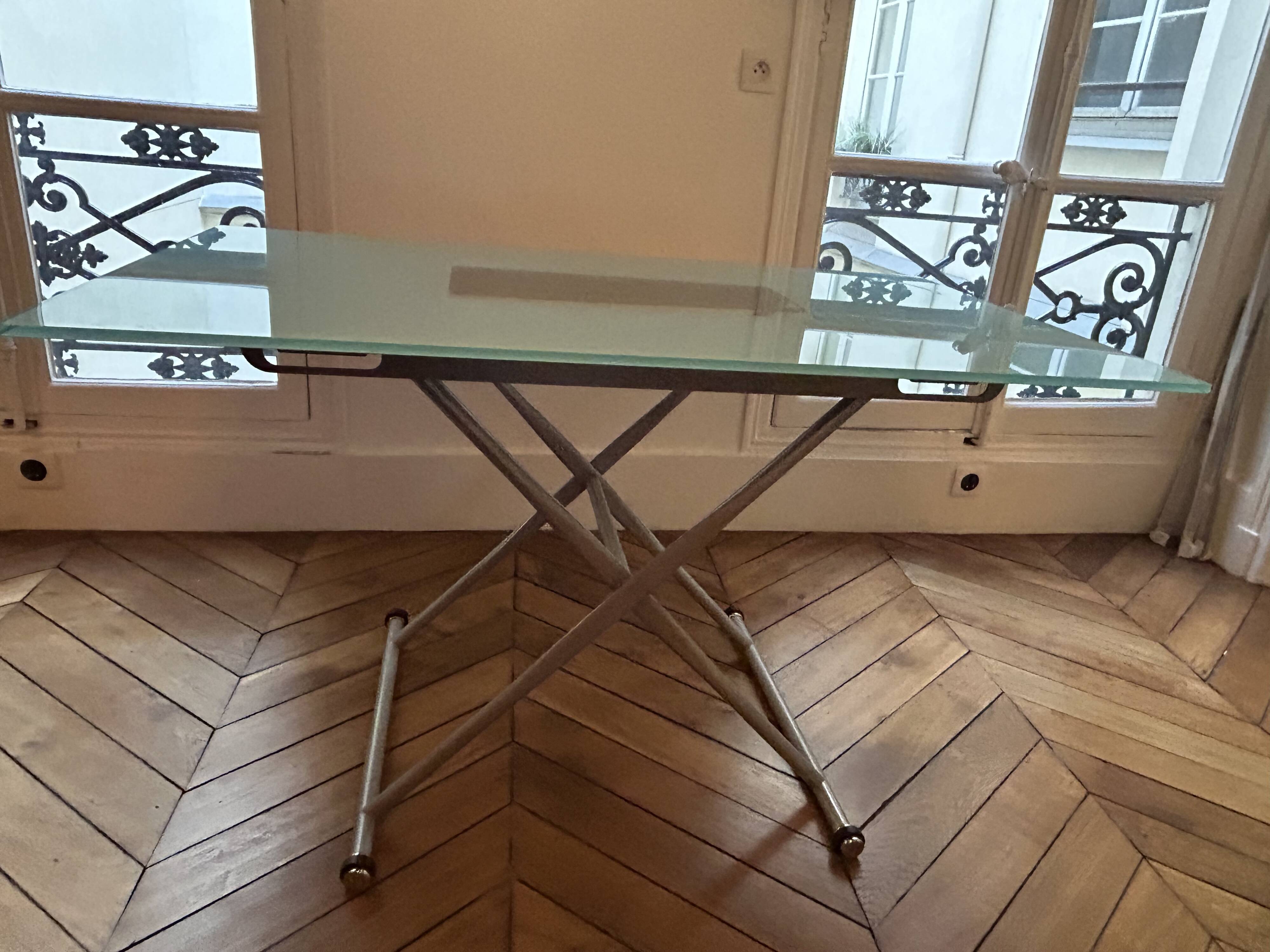 Table that can be transformed into a coffee table with 2 height settings