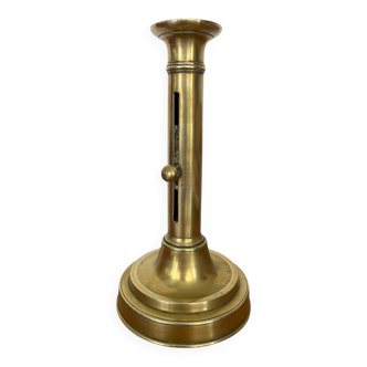 Antique brass push candle holder