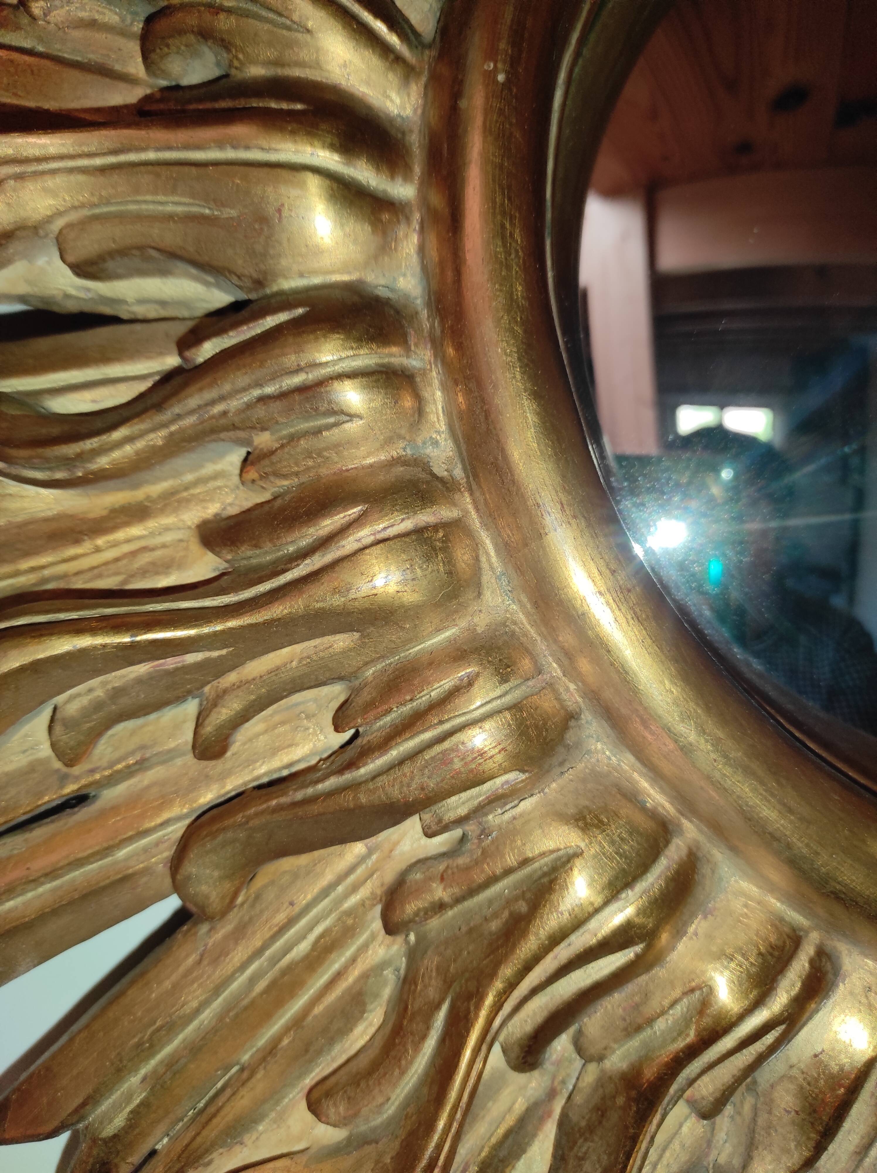 Sun mirror and witch's eye in gilded wood