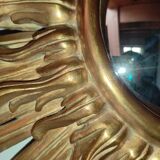 Sun mirror and witch's eye in gilded wood