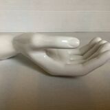 Coat hook representing a hand