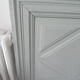 Headboard made with an old walnut door, re-enchanted in gray green waxed finish,