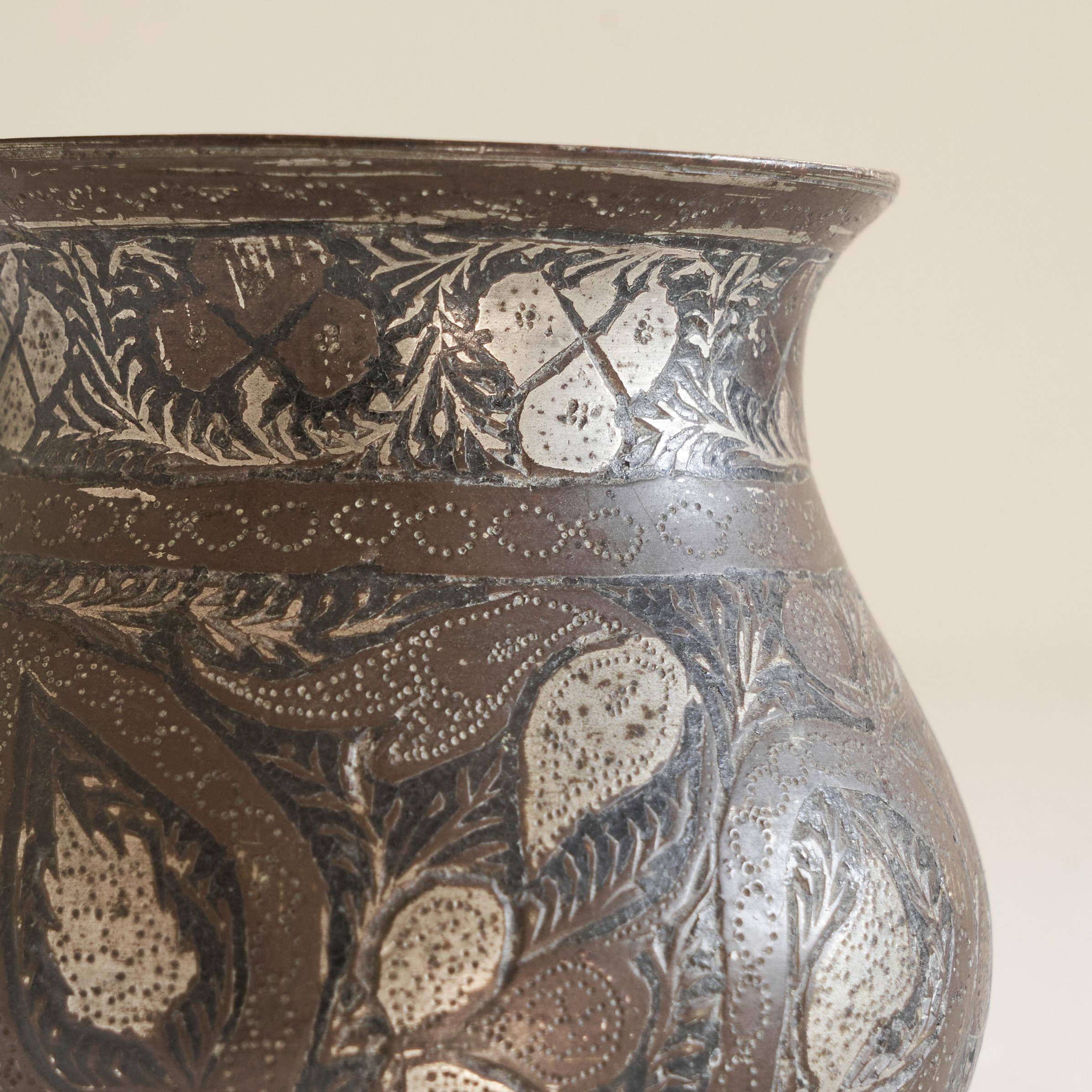 Antique pyriform Bidri vase in the shape of a pyramid.