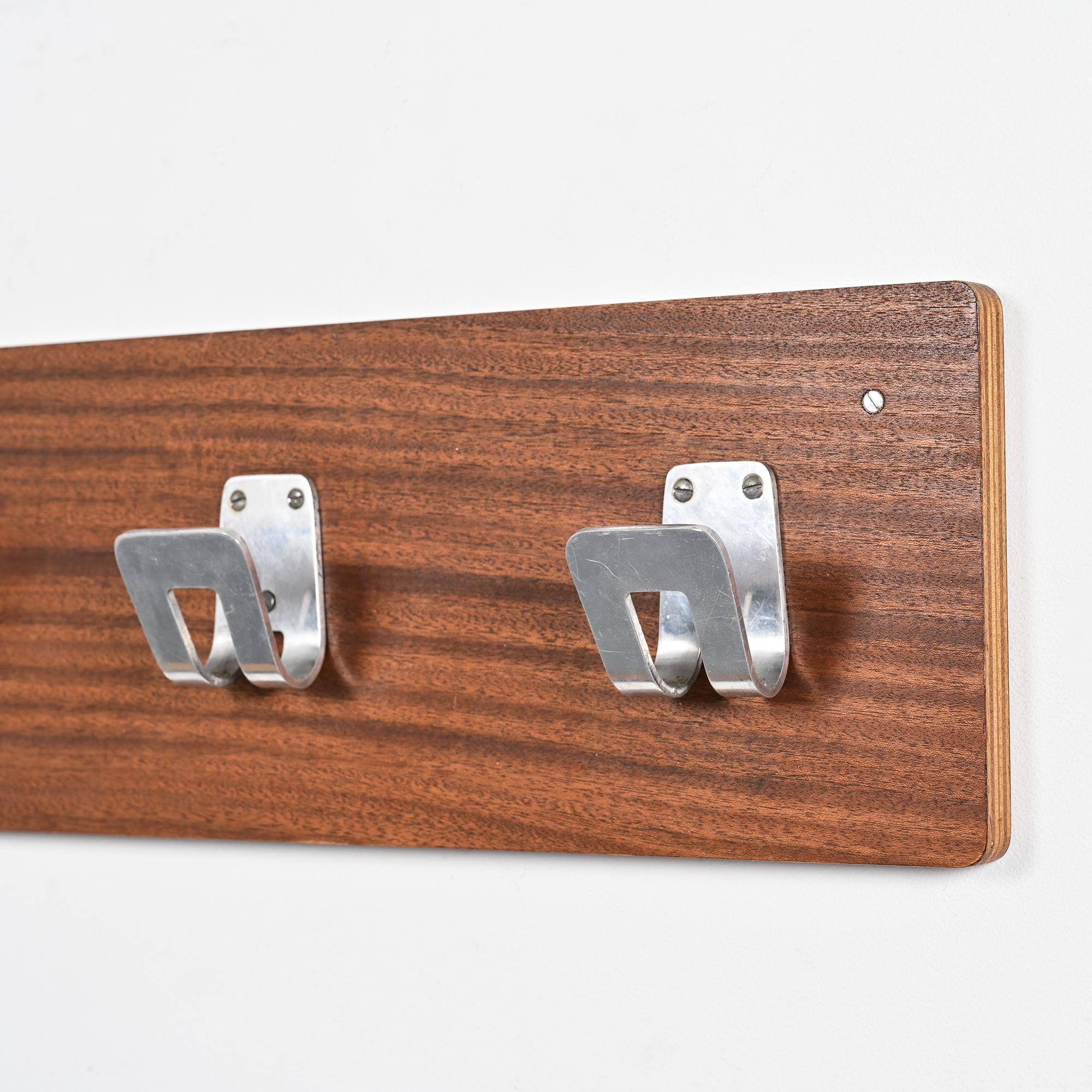 Wall coat rack and lights by Pierre Guariche for La Plagne, around 1968.