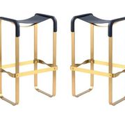 Pair of blue metal and brass stools without a backrest.