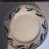 Six flat earthenware plates decorated with holly
