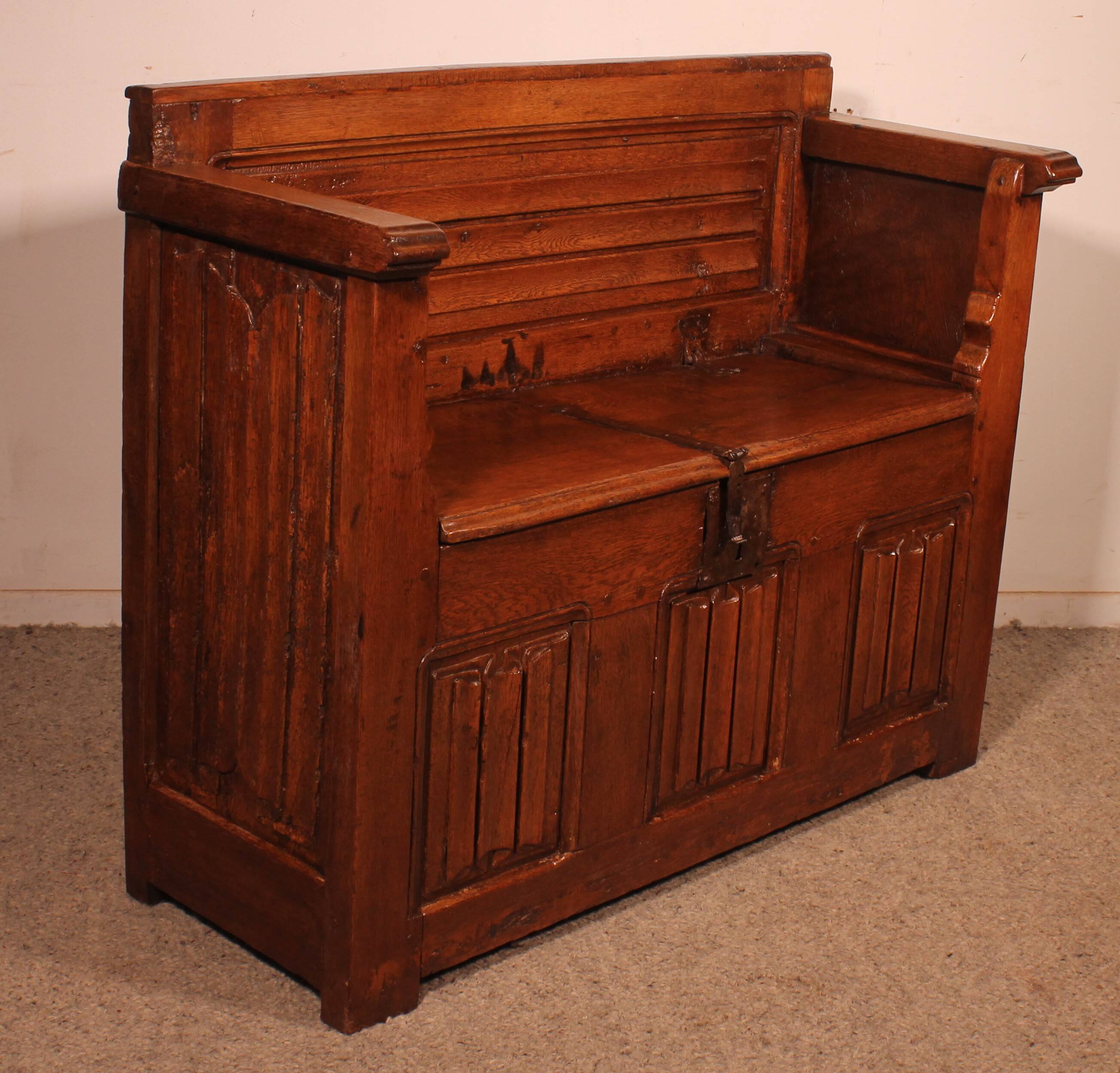 Oak bench chest with incorporated panels and gothic elements
