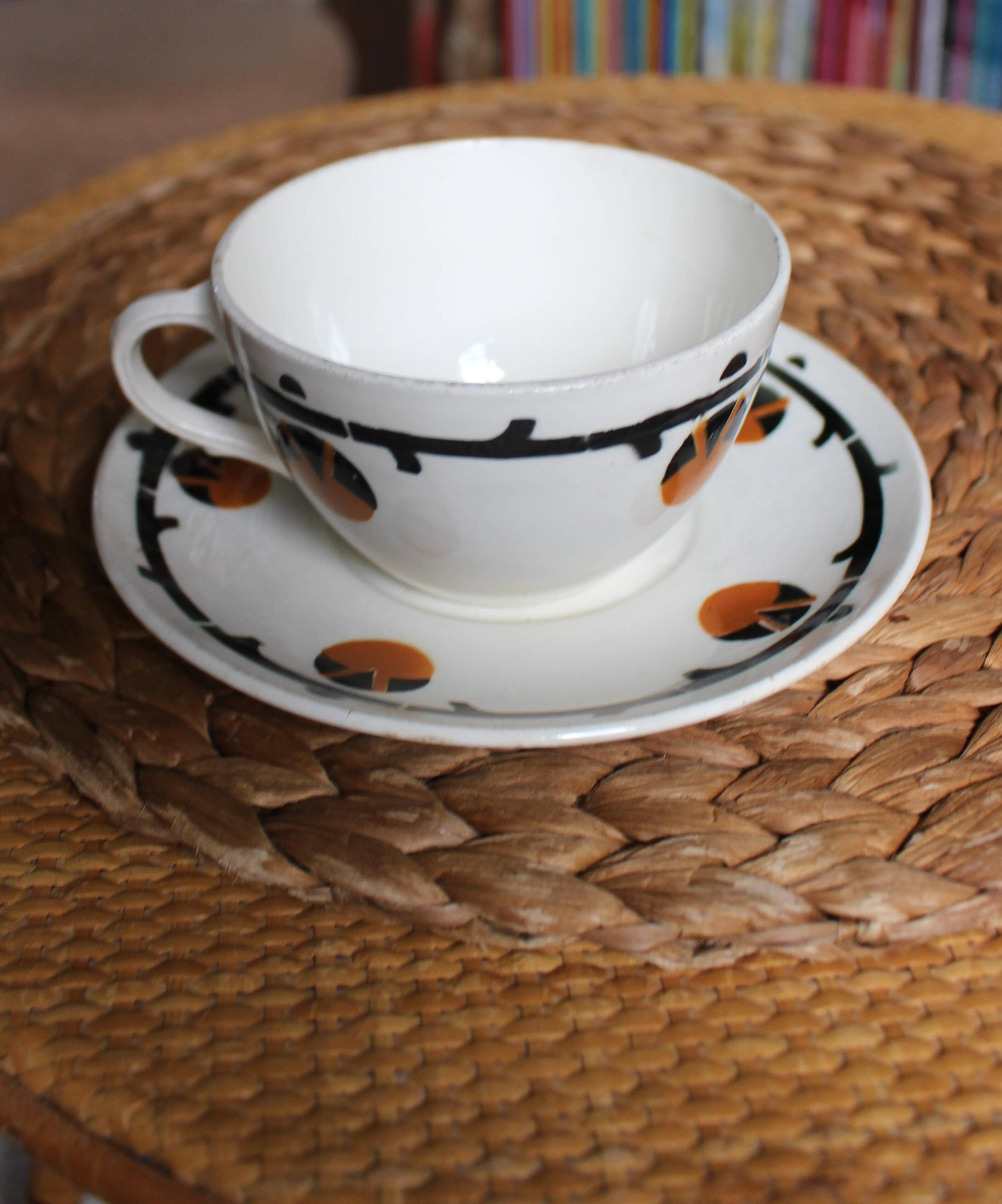 A large cup of chocolate tea, saucer Badonviller Barcarolle orange black.