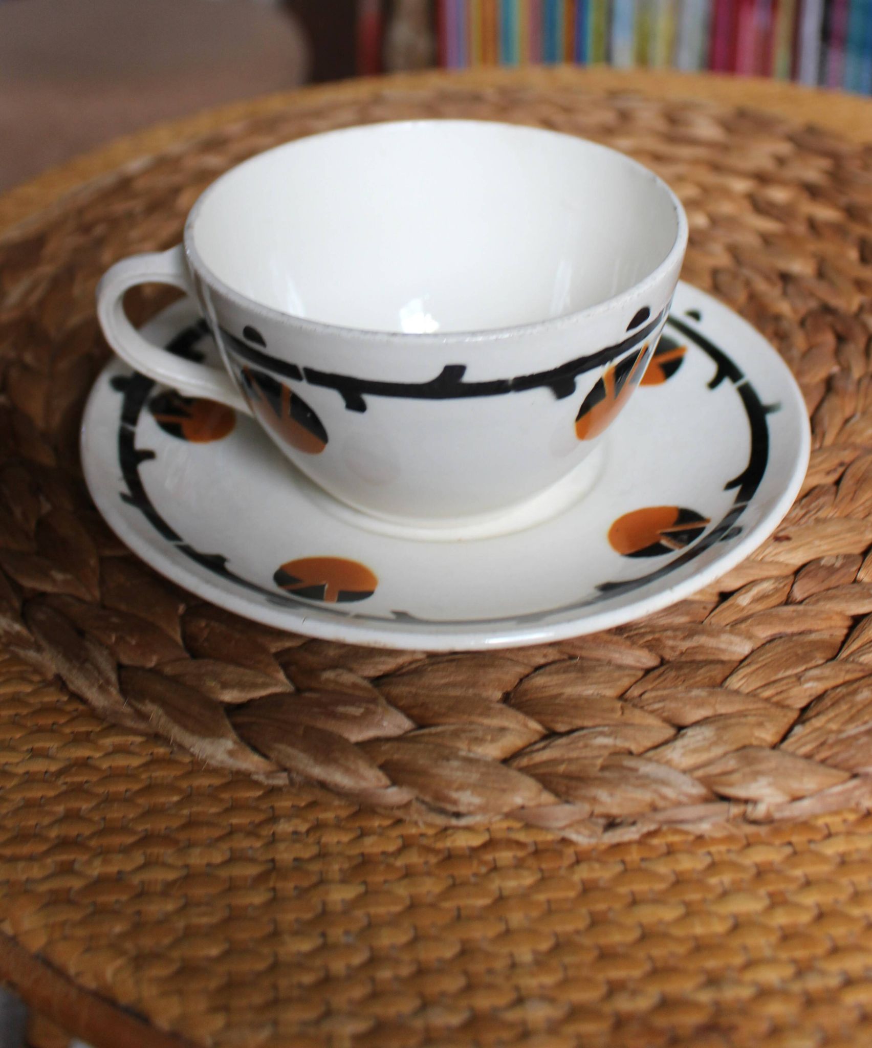 A large cup of chocolate tea, saucer Badonviller Barcarolle orange black.