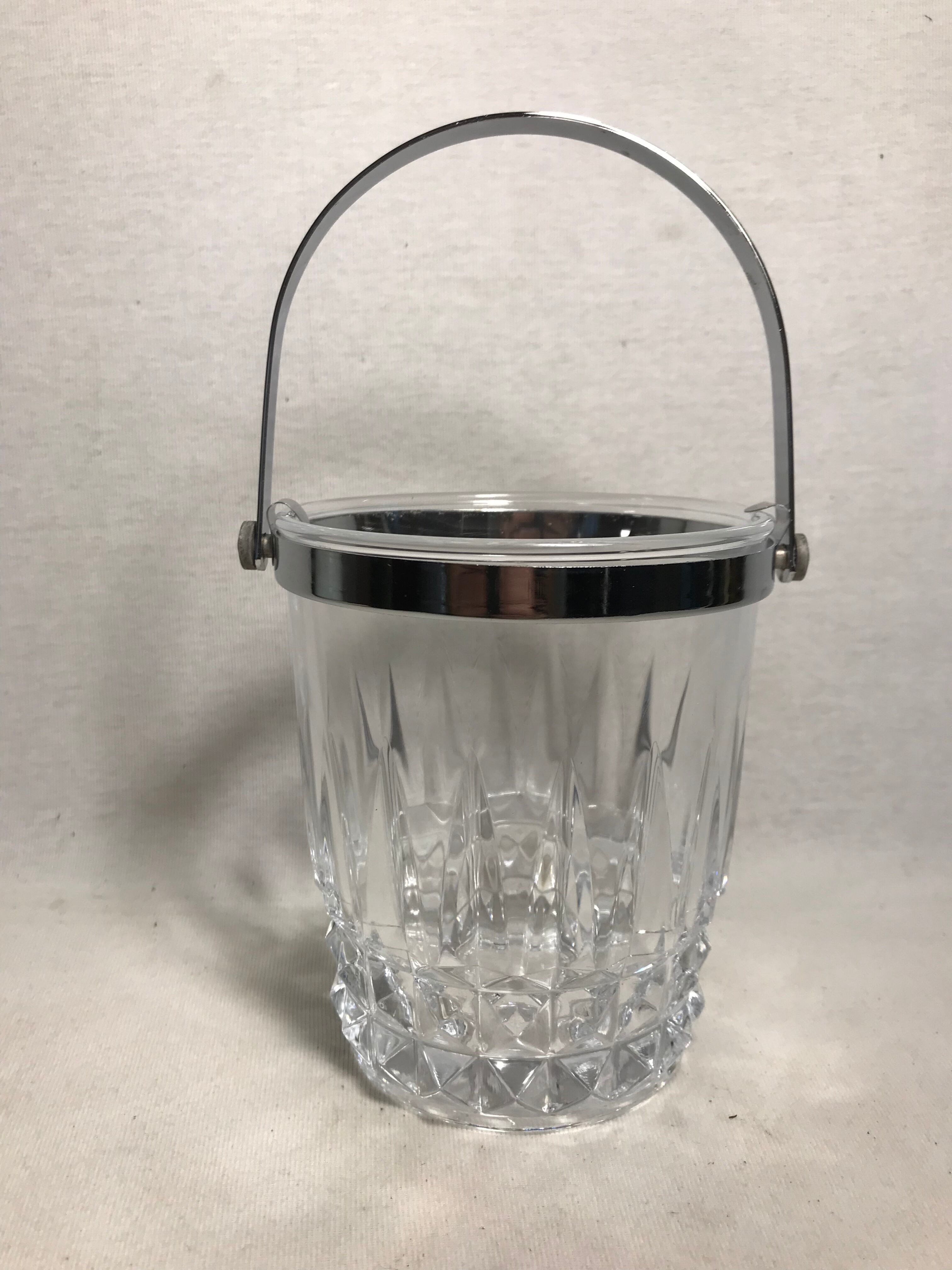 Old arched crystal ice bucket with chrome metal handle