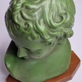 Bust of Eros in patinated plaster in imitation of bronze on wooden base