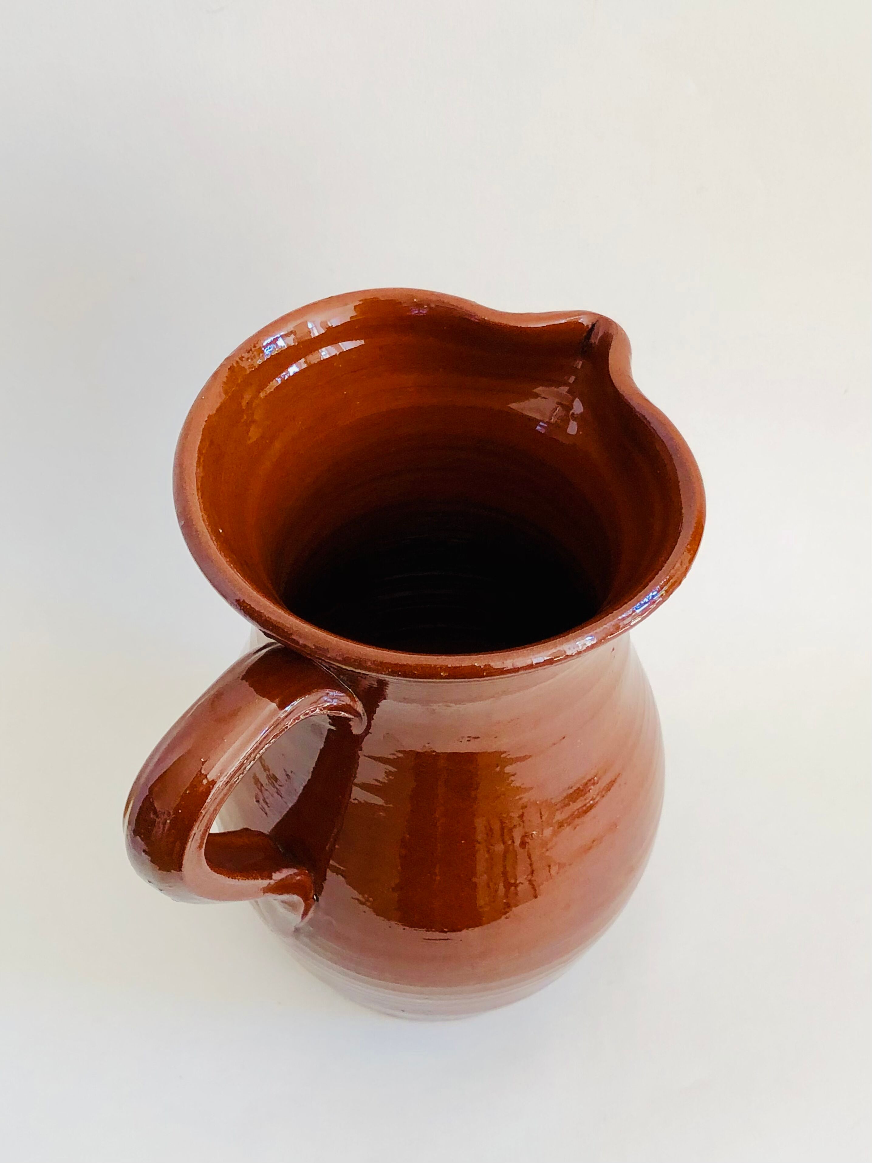 Vintage pitcher in glazed earth
