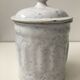 Vintage coffee pot in white enamelled iron and blue retro kitchen decoration