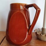 Pitcher in brown sandstone