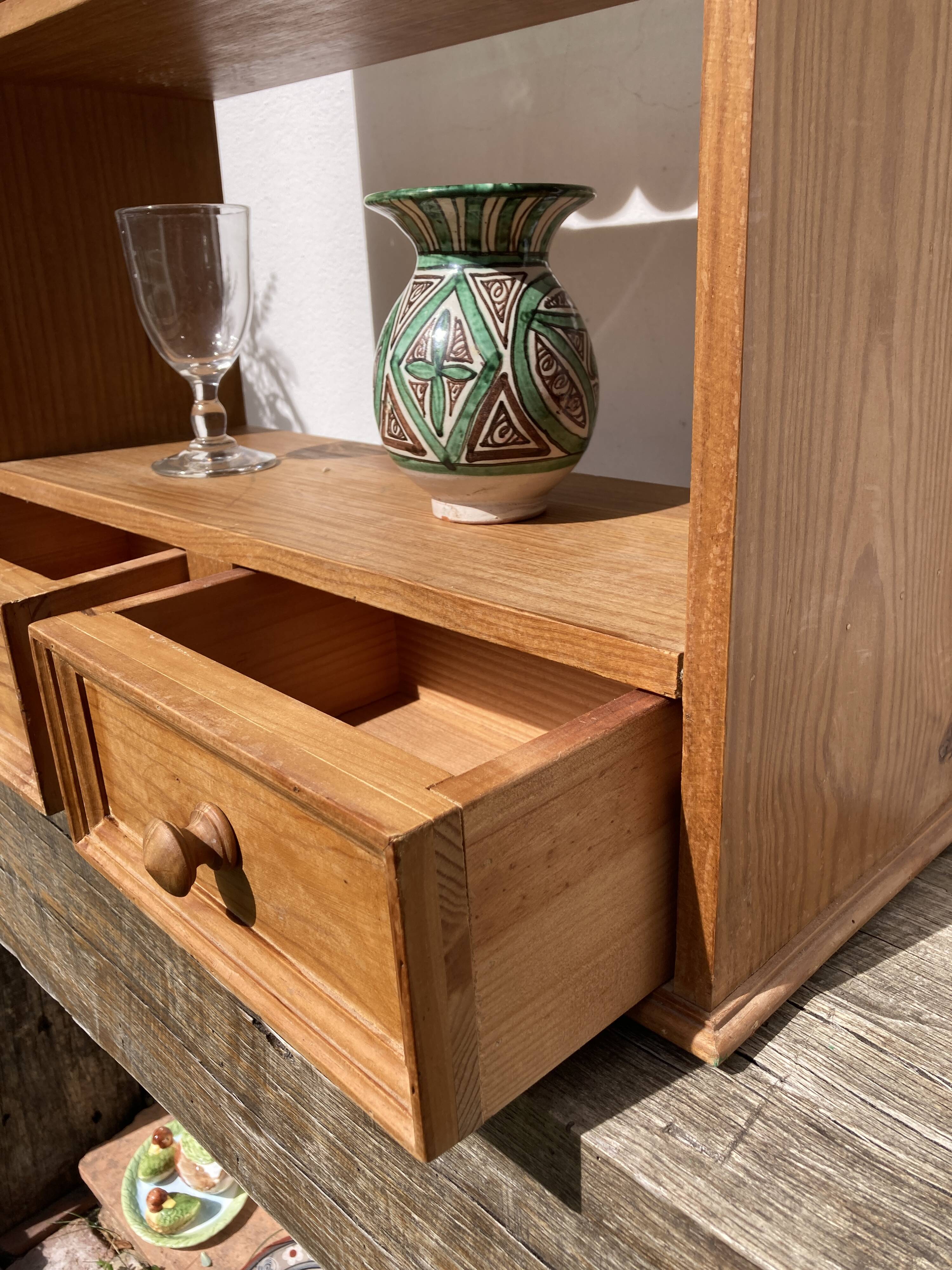 Wall shelf in raw wood with drawers and openwork hearts