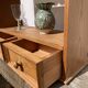 Wall shelf in raw wood with drawers and openwork hearts