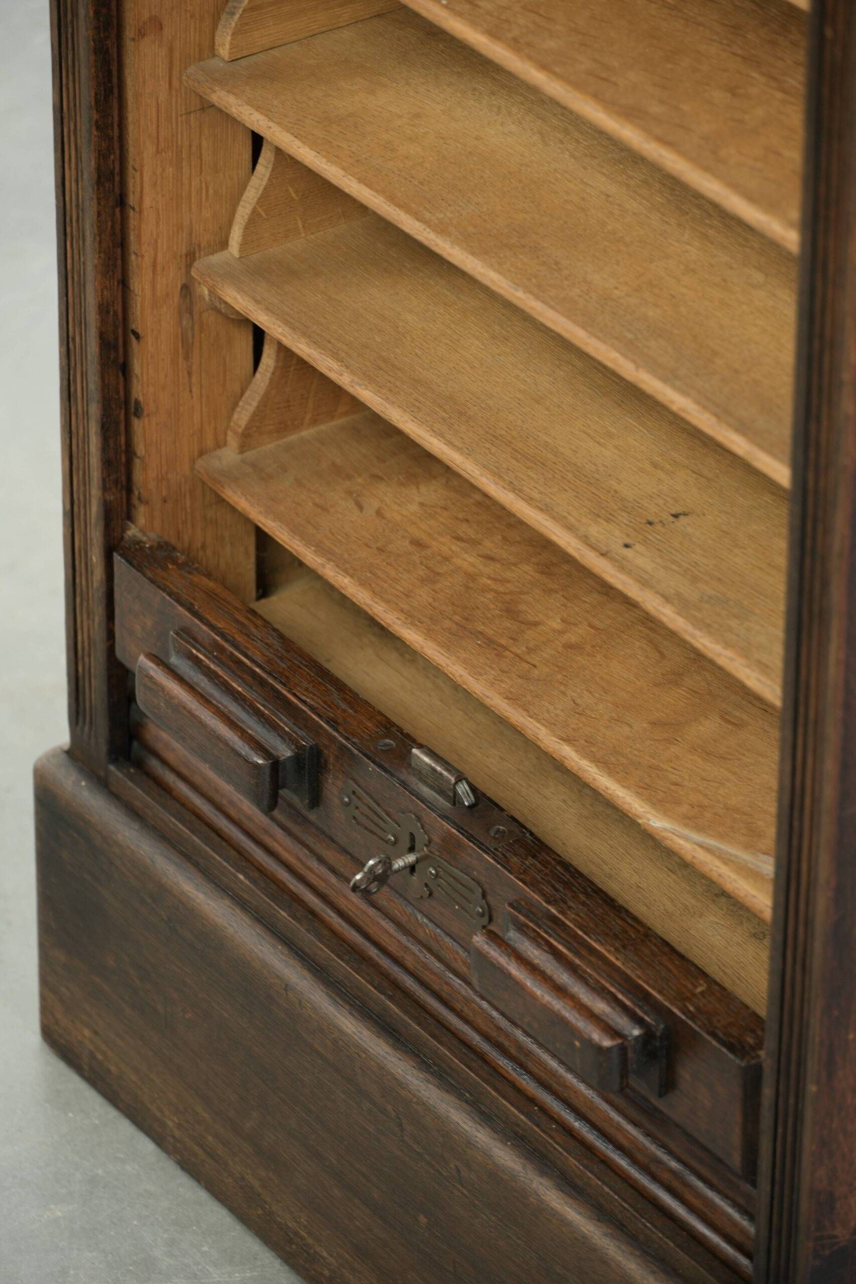English antique archive cabinet with oak roll-up door from the 20th century