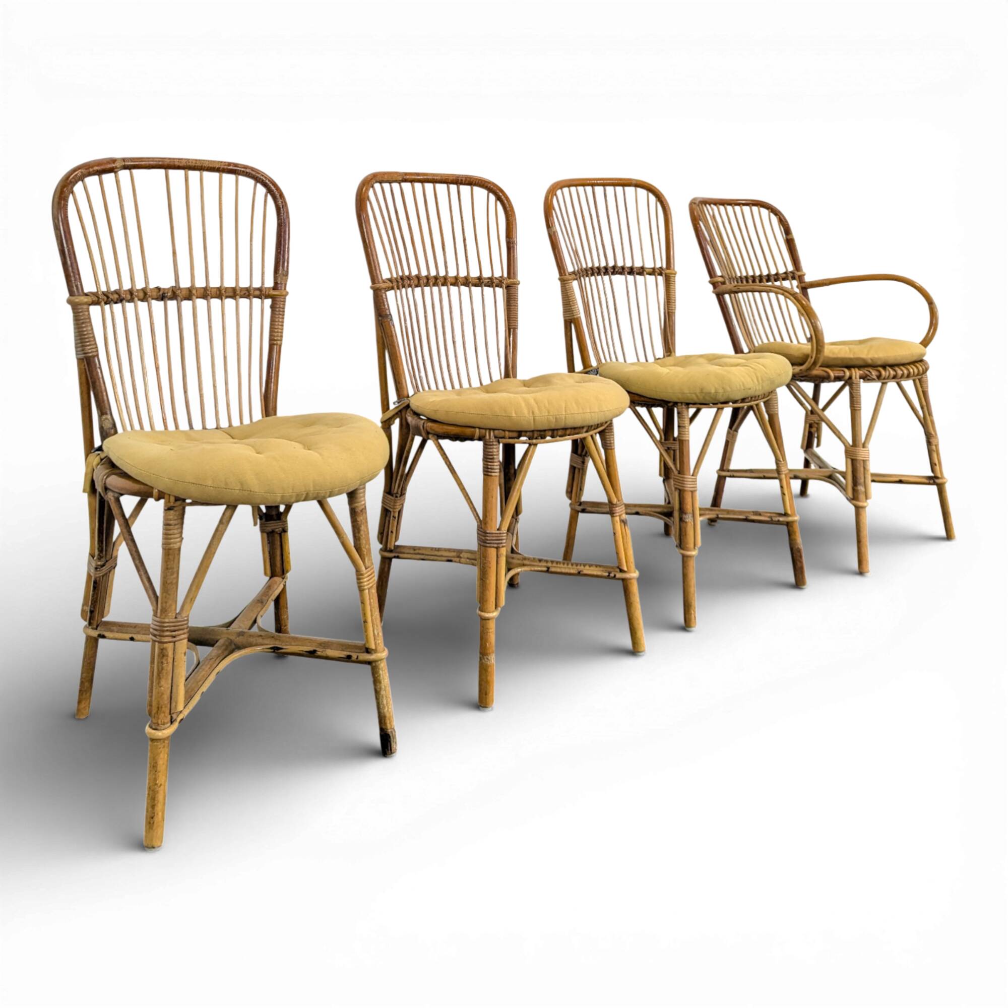 Set of 3 chairs and a rattan armchair.