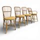 Set of 3 chairs and a rattan armchair.