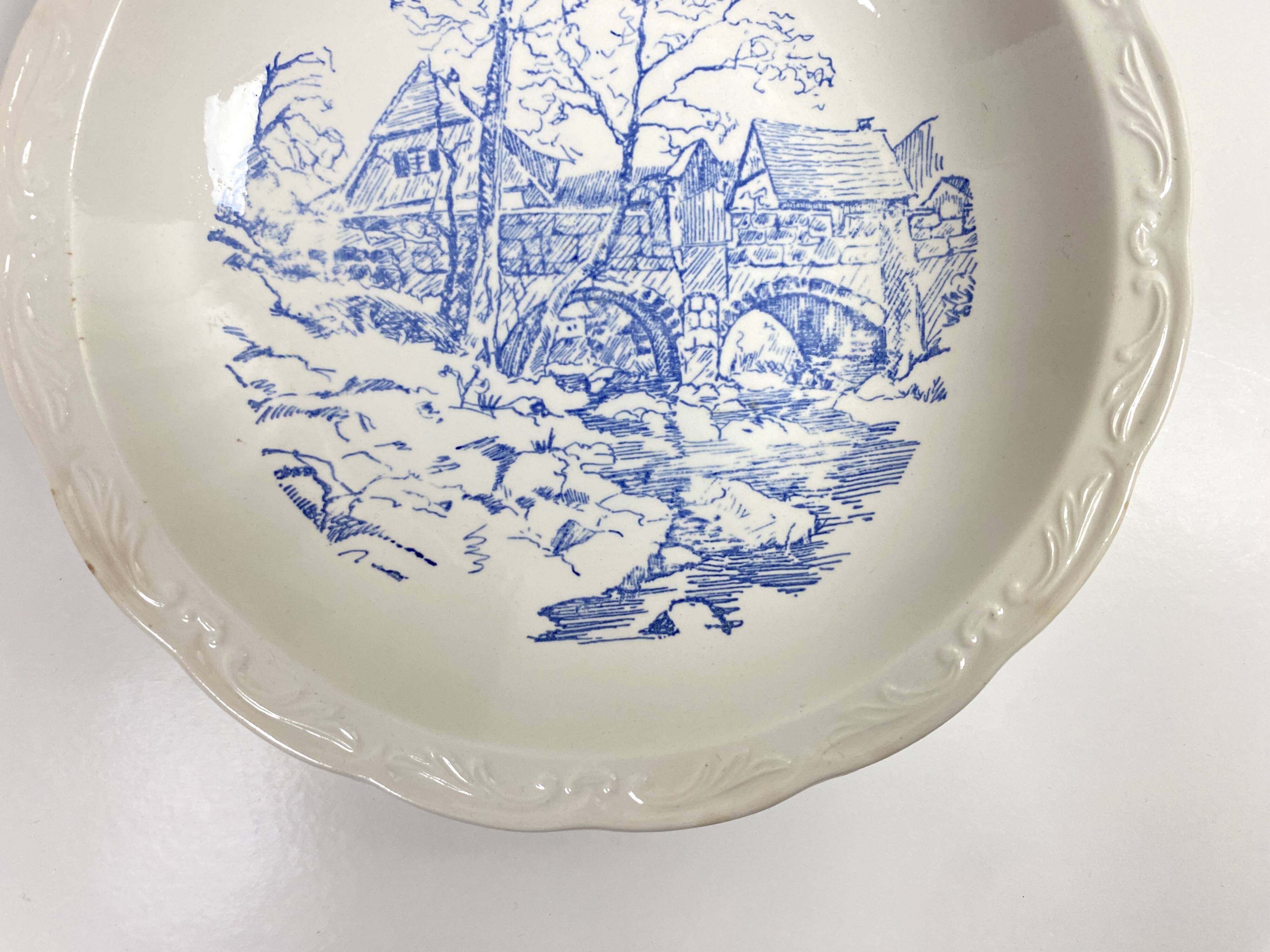 Set of two matching soup plates, one plain and one decorated