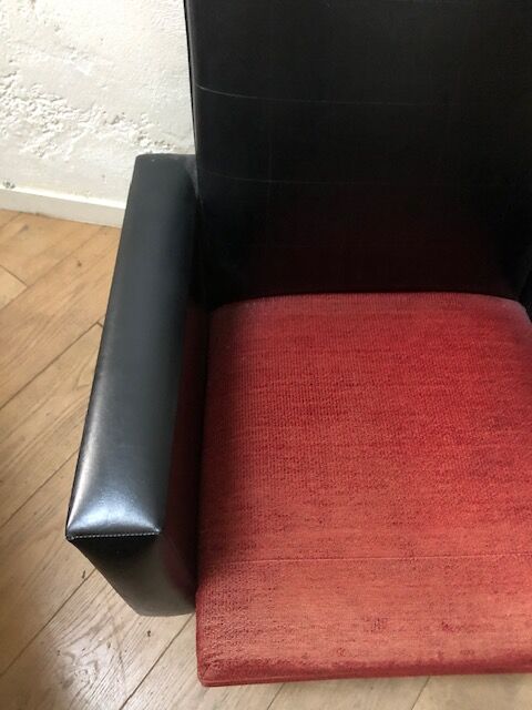 Vintage armchair in red and black skaï