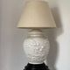 1980s ceramic table lamp with a wooden base and adjustable shade.