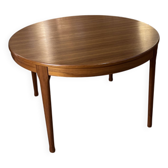 Scandinavian-style round teak table with two independent extensions